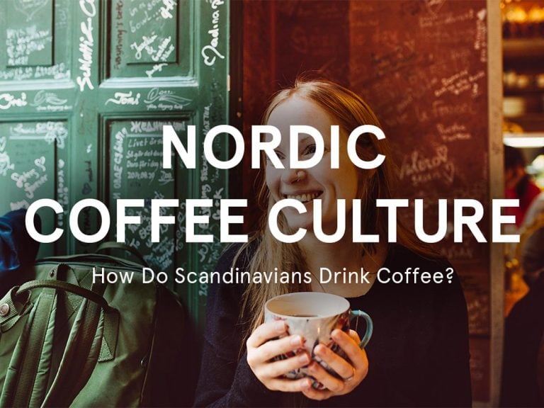 Woman holding a mug of coffee, sitting in front of a green chalkboard with handwriting. Text overlay reads, "Nordic Coffee Culture: How Do Scandinavians Drink Coffee? Discover the rich traditions that make Sweden's caffeine rituals unique and inviting.